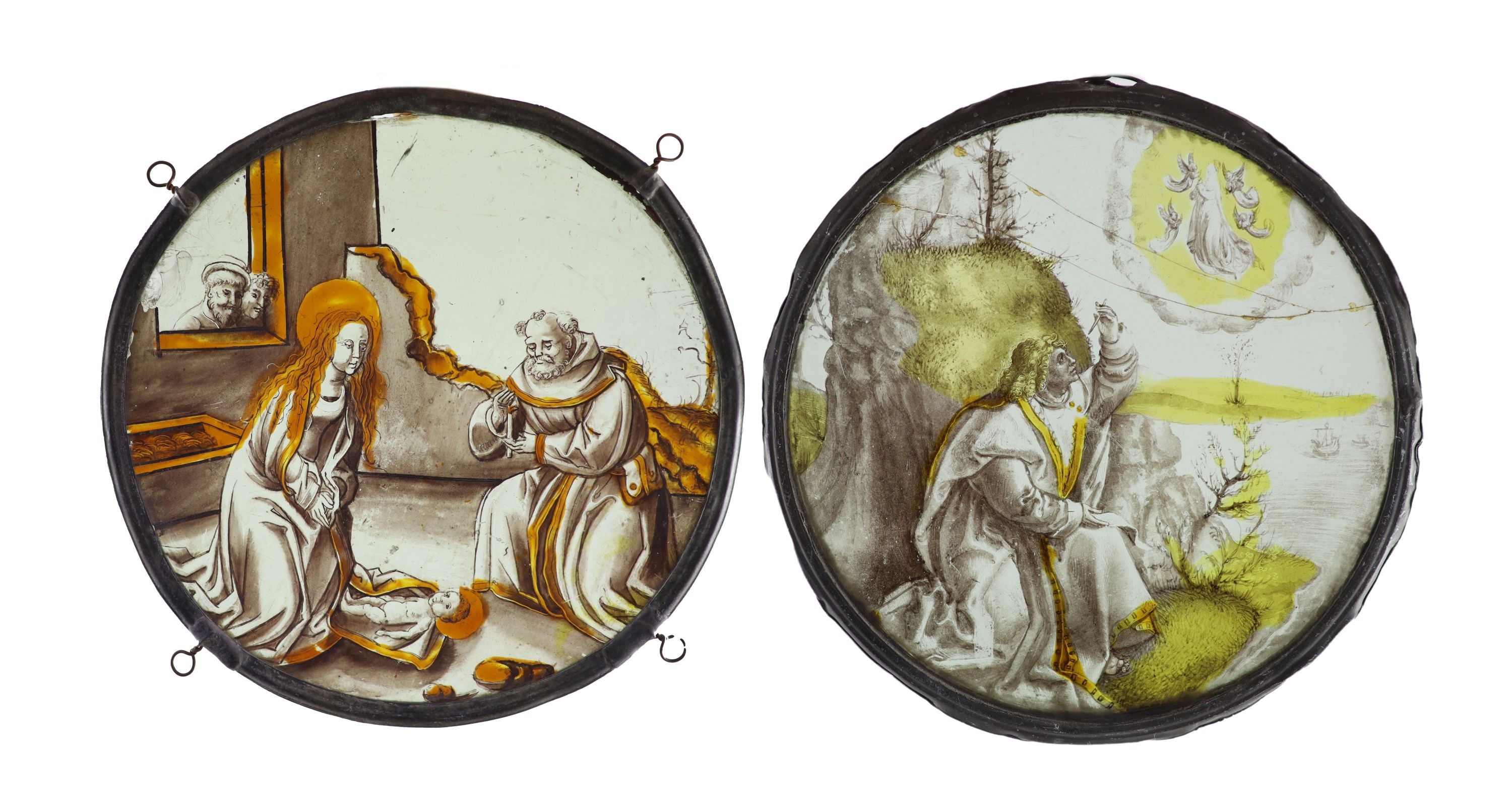 Two 16th century Netherlandish stained glass roundels, ‘’The Nativity’’ and ‘’St. John on Patmos, 23 and 24.5 cm diameter